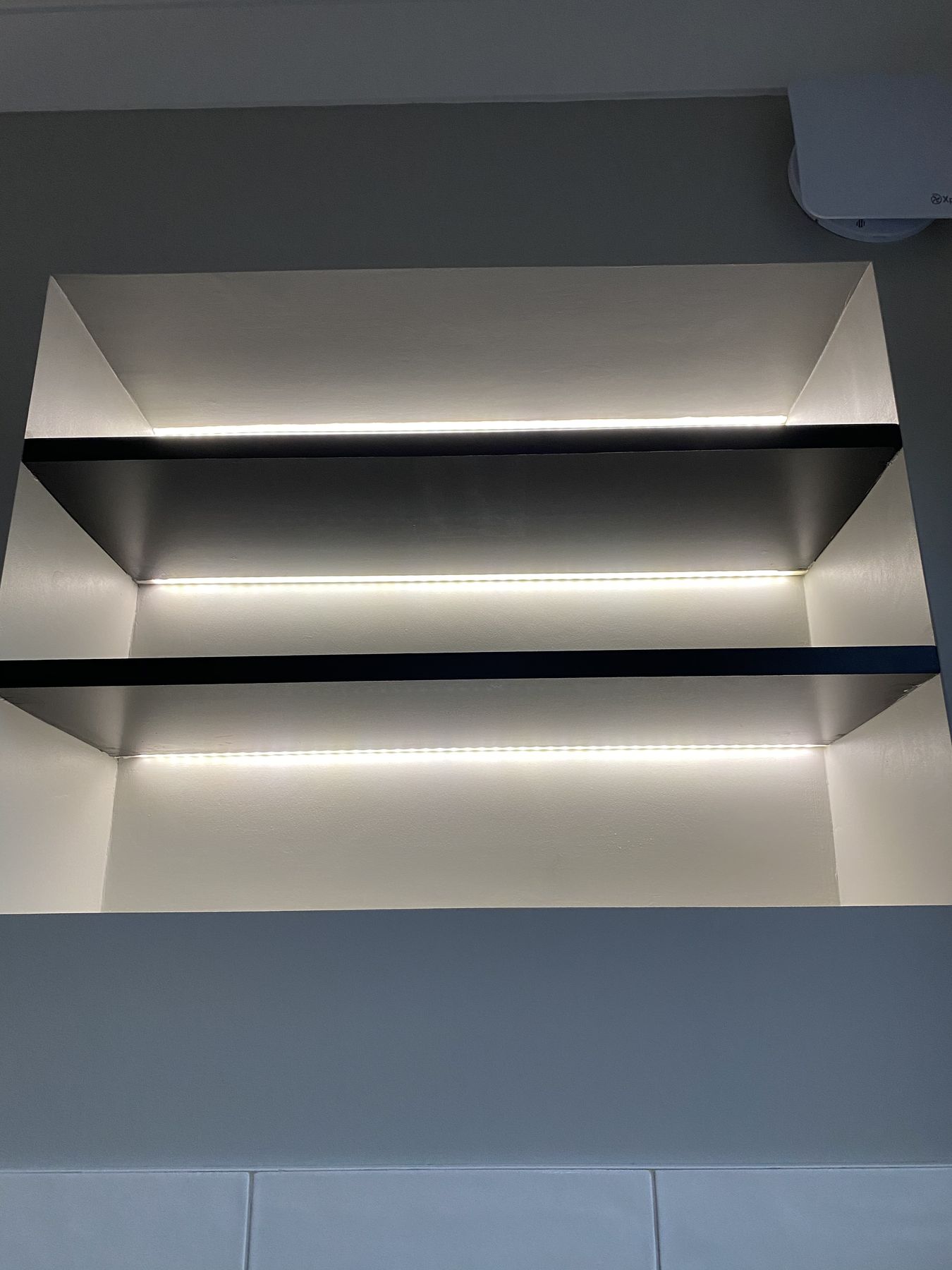 Lit recessed shelving