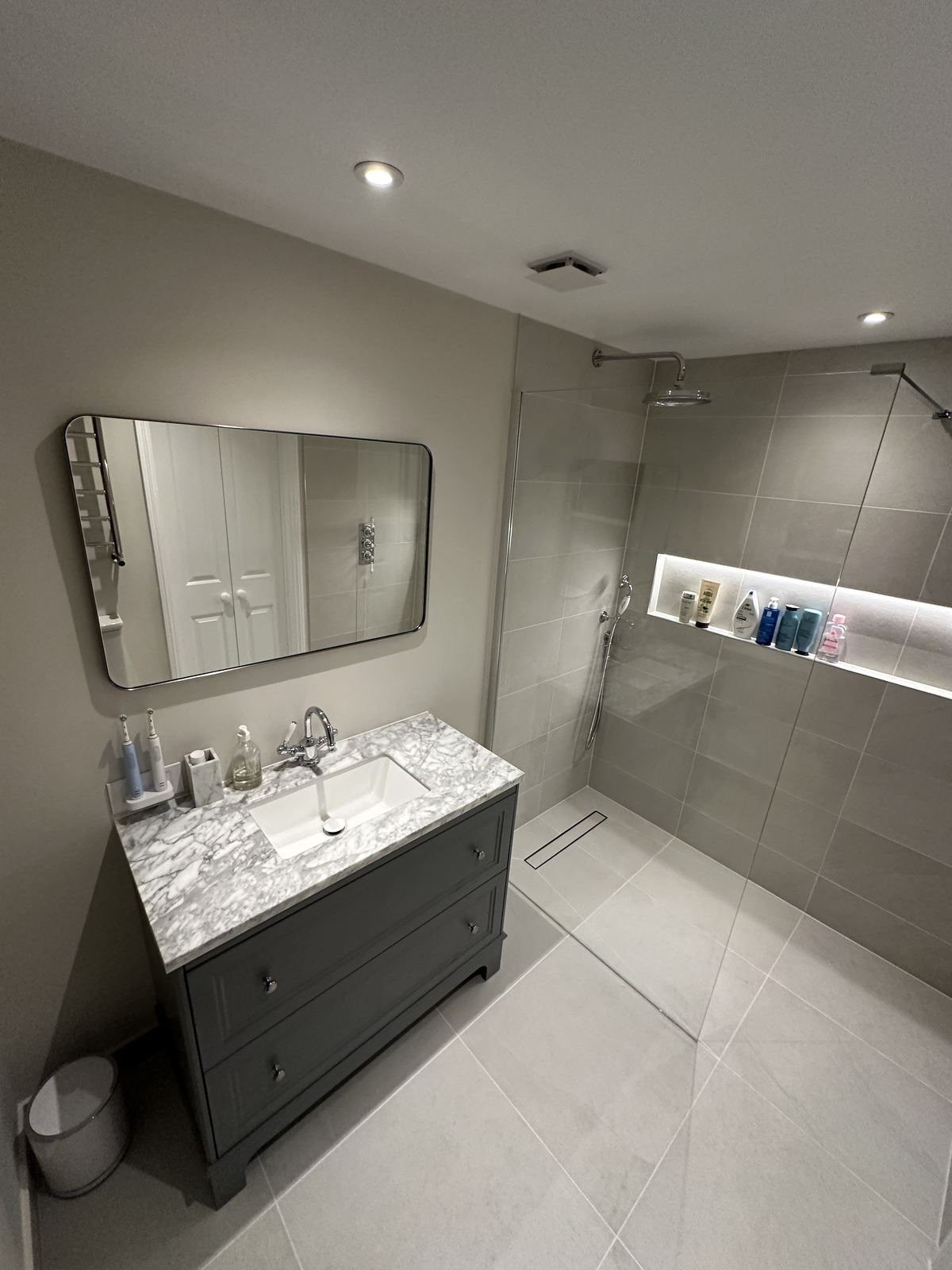 Integrated vanity and storage — En-suite Bathrooms in London